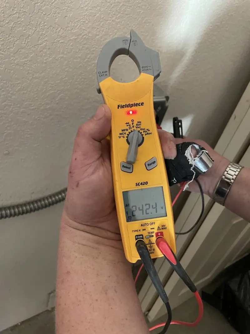 Voltage testing with clamp meter during Outlet Installation in Chandler